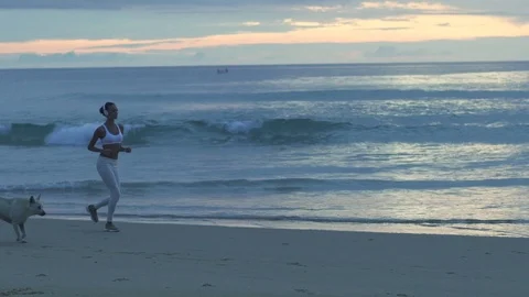 Young Girl Doing Exercises On The Beach Stock Footage 70986249