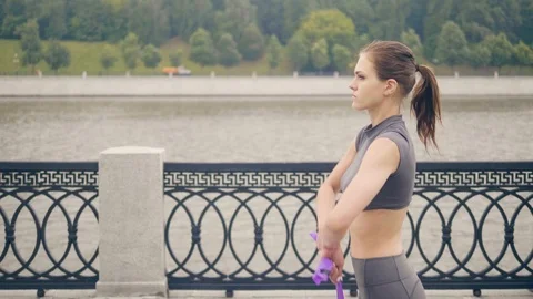 Young girl doing gym exercise with sport expander while fitness training Stock Footage 94171053