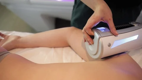 Young girl doing medical procedures in the spa salon. Anti-cellulite massage Stock Footage 121107553