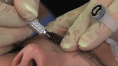 Young girl doing microblading procedure Stock Footage 113633182