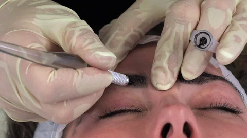 Young girl doing microblading procedure Stock Footage 113634807