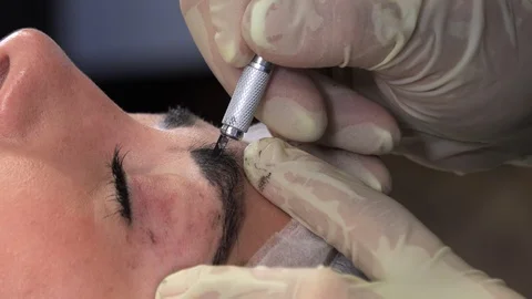 Young girl doing microblading procedure Stock Footage 114109236