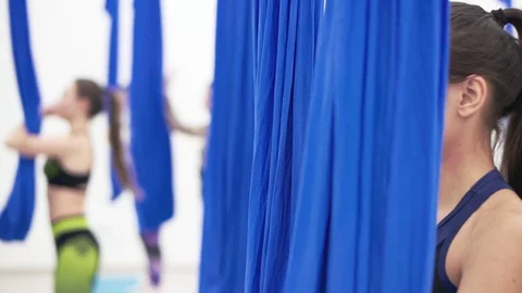 Young girl doing stretching exercise with fitness hammock. 스톡 동영상 101782634