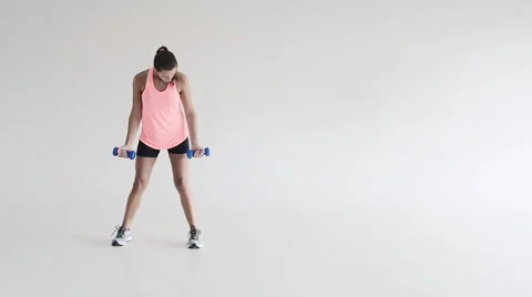 Young girl doing workout with dumbells Stock Footage 62209540