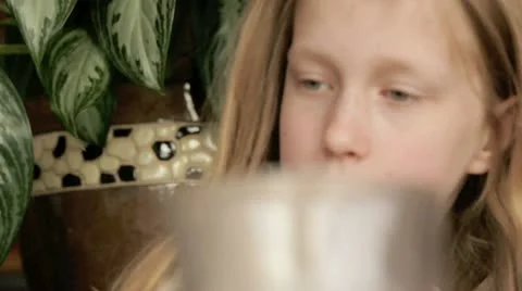 Young girl drinking lemonade Видео 10921338