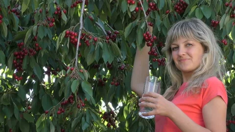Young girl eats cherry Stock Footage 90524622