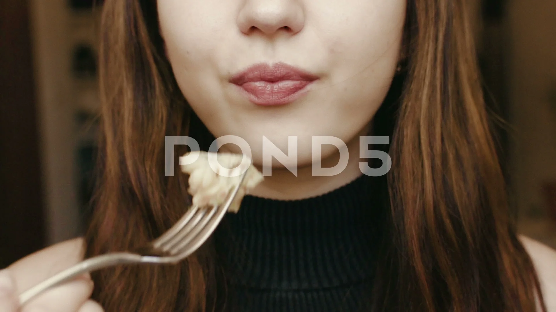 A young girl eats with a fork. Face clos, Stock Video