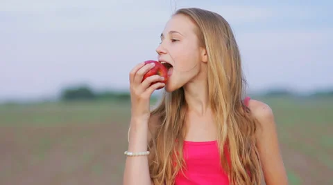 Young Girl Eats Fresh Apple Outdoor, Children Healthy Food HD Stock Footage 31854822