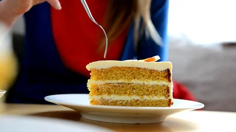 Young girl eats pumpkin cake in the cafe. Stock Footage 75153838