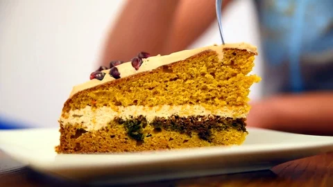 Young girl eats pumpkin cake in the cafe. Stock Footage 81738002