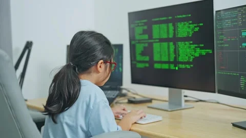 Young Girl Engaged in Coding Activities at Home, Learning Programming Skill.. Stock Footage 319823378