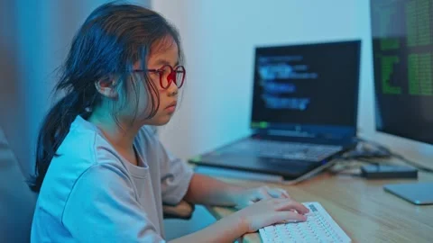 Young Girl Engaged in Computer Programming at a Modern Workspace with Techn.. Video stock 319823385
