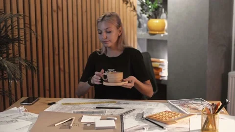 Young girl engineering student drinking hot coffee Stock Footage 223119701