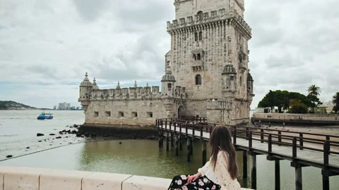 A young girl exploring Torre de Belém Tower in Lisbon, Portugal, Europe. Stock Footage 169659869