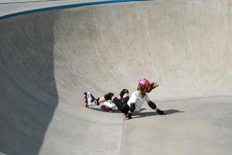 Young Girl Falling During Inline Skating Training Session Stock Photos