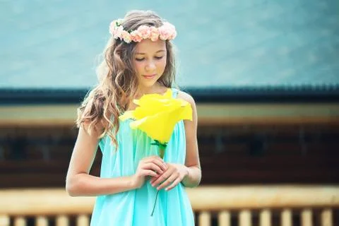 Young girl with flower Stock Photos
