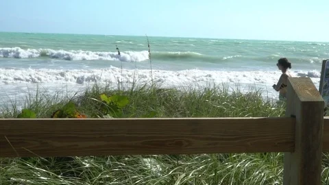 Young girl in front of breaking waves in Slow Motion Stockbeeldmateriaal 78161307