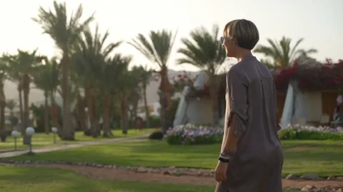 Young girl in grey outfit catching a frisbee slow motion Stock Footage