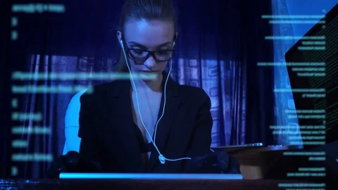 Young girl hacker working with computer code Stock Footage 77615637