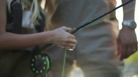 Young girl hands while fly fishing Stock Footage 35174577