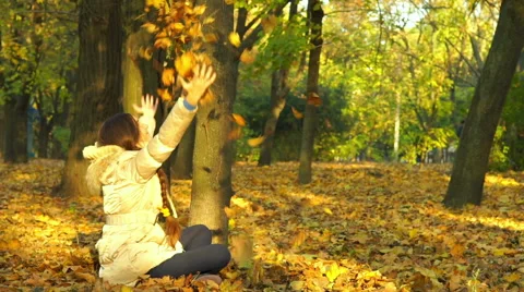 Young Girl Having Fun Throwing Yellow Leaves. Stock-Footage 56855891