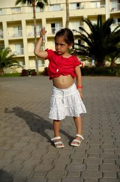 Young girl holding key Stock Photos