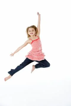 Young Girl Jumping In Mid Air Stock Photos