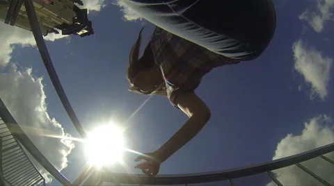 A young girl is jumping over an action camera Stock Footage 59222134