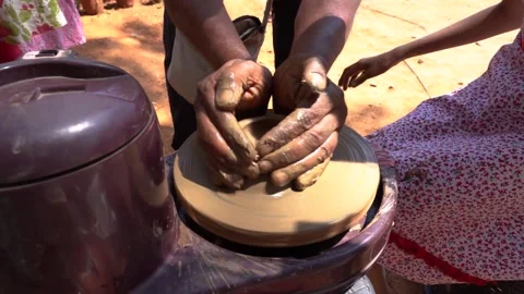 Young girl learning to do pottery with wet clay 動画素材 147967967
