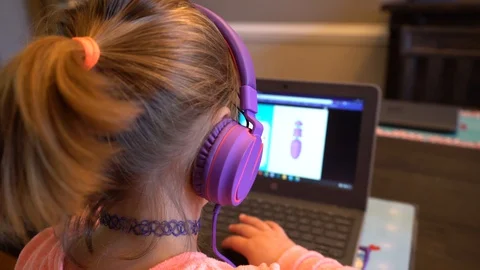 Young girl learning on laptop Stock Footage 127590976