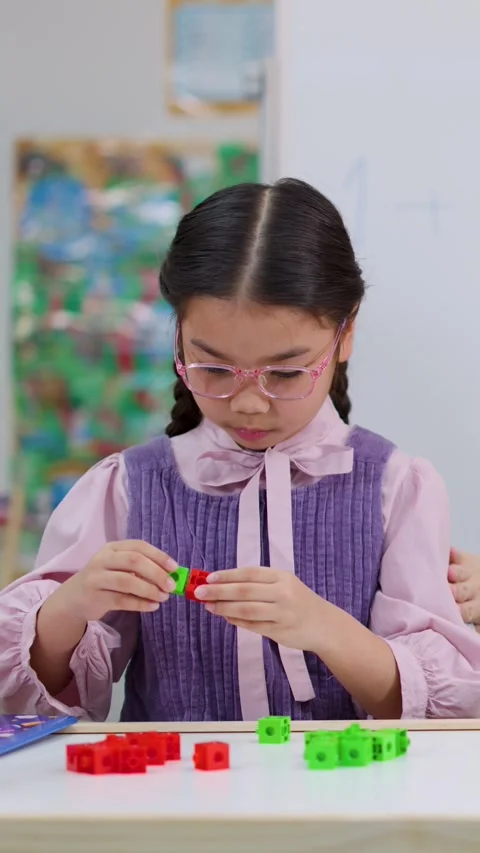 Young Girl Learning Mathematics Using Colorful Interlocking Stock Footage 327770897