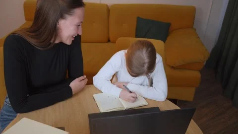 Young girl learning with teacher using laptop and books Stock Footage 317815363