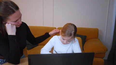 Young girl learning with teacher using laptop and books Stock Footage 317815370