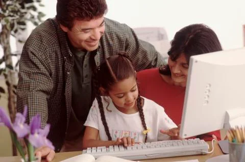 Young girl learning to use a computer Stock Photos