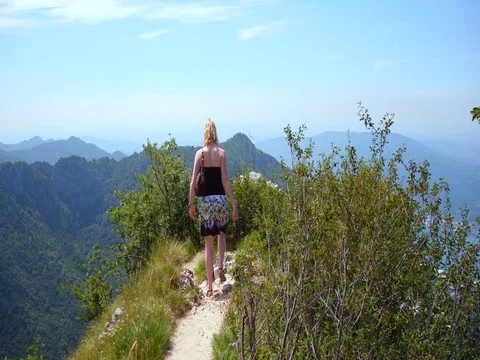 Young girl looking at view of Como on mountain top in Italy Stock-Footage 80194756