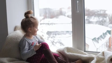 Young girl looking in the window Stock Footage 69991702