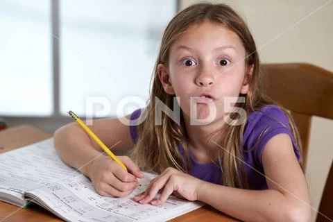 funny kid doing math homework