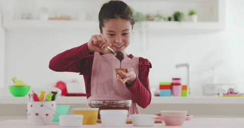 Young girl making sweets in the kitchen Video stock 239408130