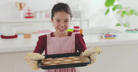 Young girl making sweets in the kitchen Stock Footage 239408249