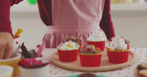 Young girl making sweets in the kitchen Stock Footage 239408855