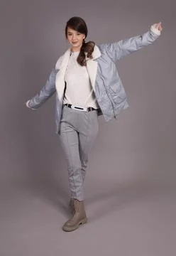 A young girl model posing at the camera demonstrates clothes in different pos Foto stock