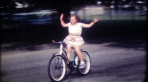 Young girl on neighborhood bicycle ride 1950s vintage film home movie 1205 Stock Footage