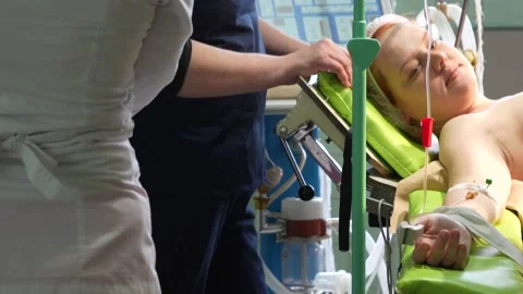 Young girl on the operating table. Preparation for the operation Stock Footage 235469405