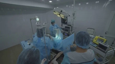 Young girl on the operating table. She is undergoing surgery on gynecology. The Stock Footage 78026810