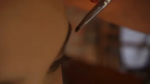 Young girl paints the eyes and brow brush Stock Footage