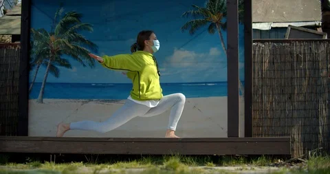 Young girl performes stretching while being isolated Stock Footage 129609496