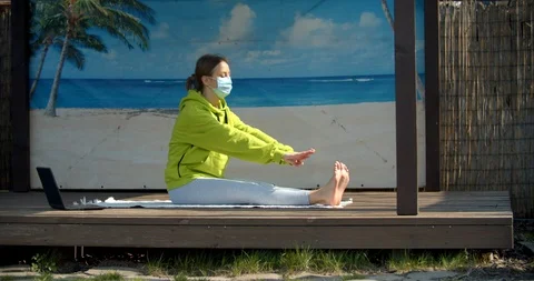 Young girl performes stretching while being isolated Stock Footage 129610318