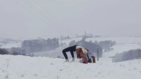 Young girl performing bridge exercise in winter Stock Footage 147855570