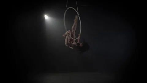 Young girl performs the acrobatic elements in the air ring 006 Stock Footage 108780887