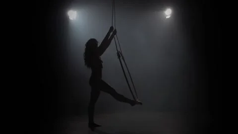 Young girl performs the acrobatic elements in the air ring. Slow motion. 019 Stock Footage 110628733
